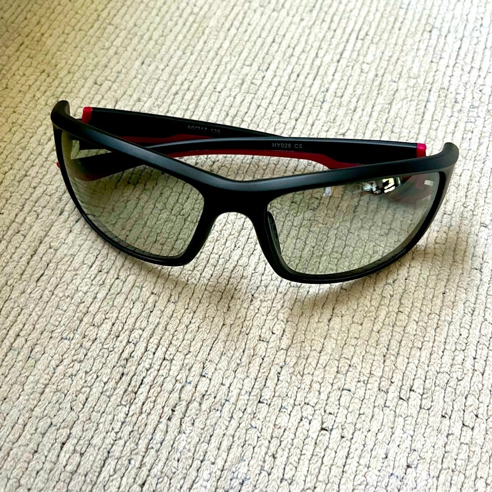 Photochromic sunglasses. Wrap around. Black with maroon stripe.